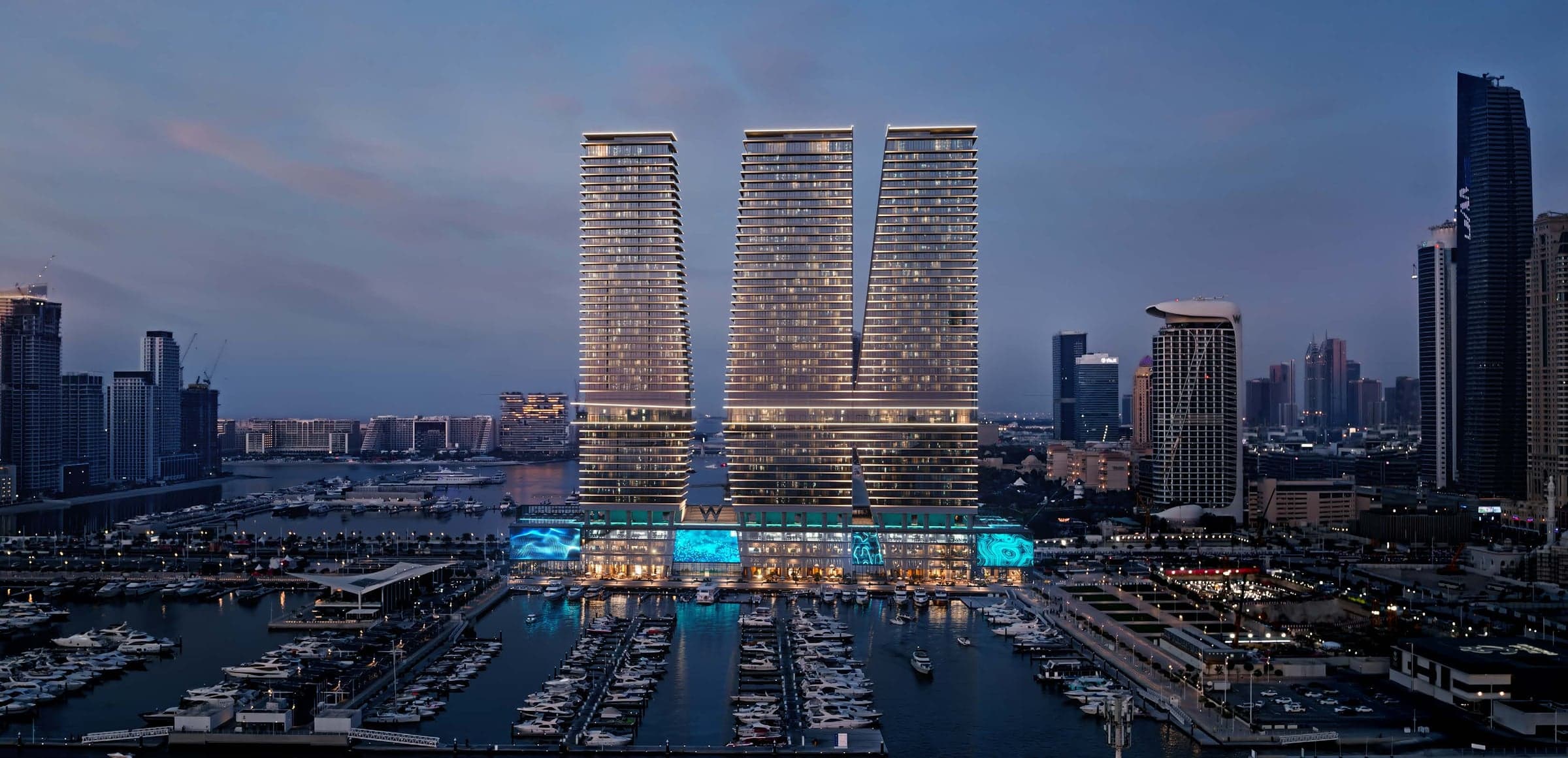 Vizuelizacija projekta W Residences at Dubai Harbour developera Arada: tri kule uz marinu u Dubai Harbouru, u sumrak